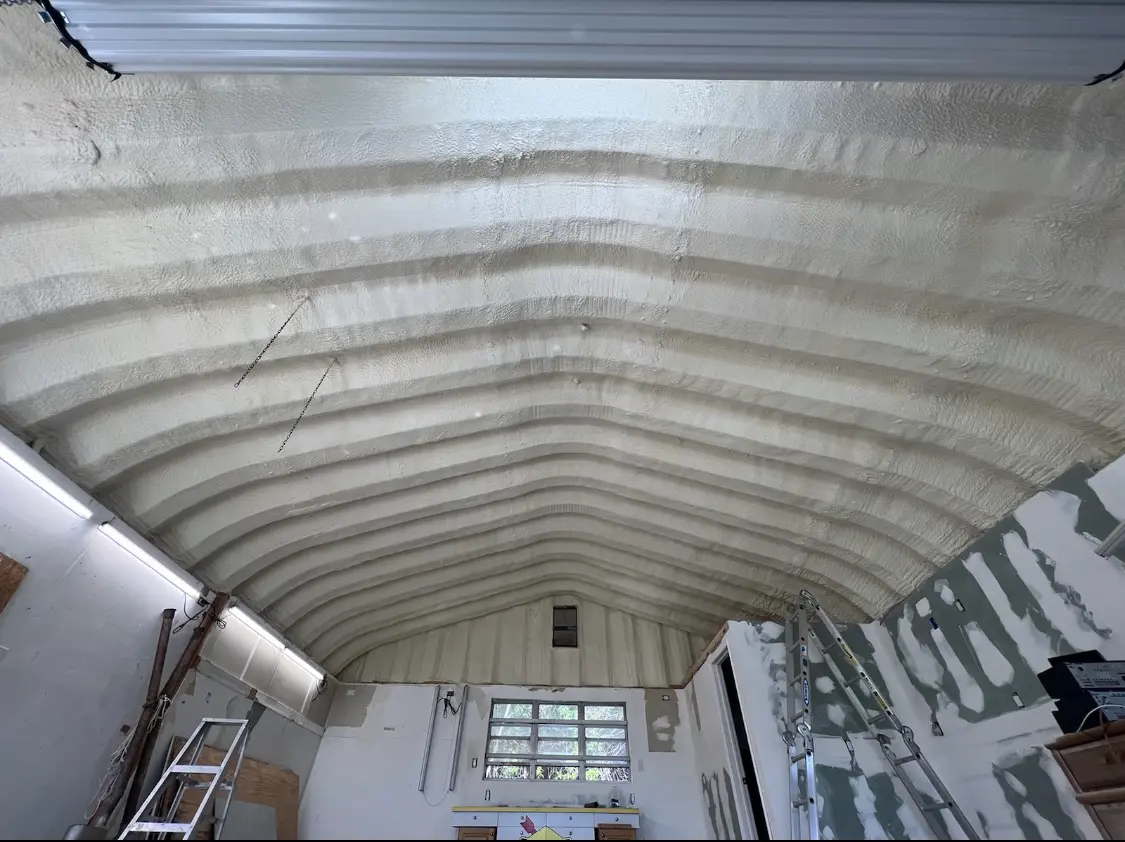 Spray polyurethane foam applied to the underside of a metal roof deck in Las Flores
